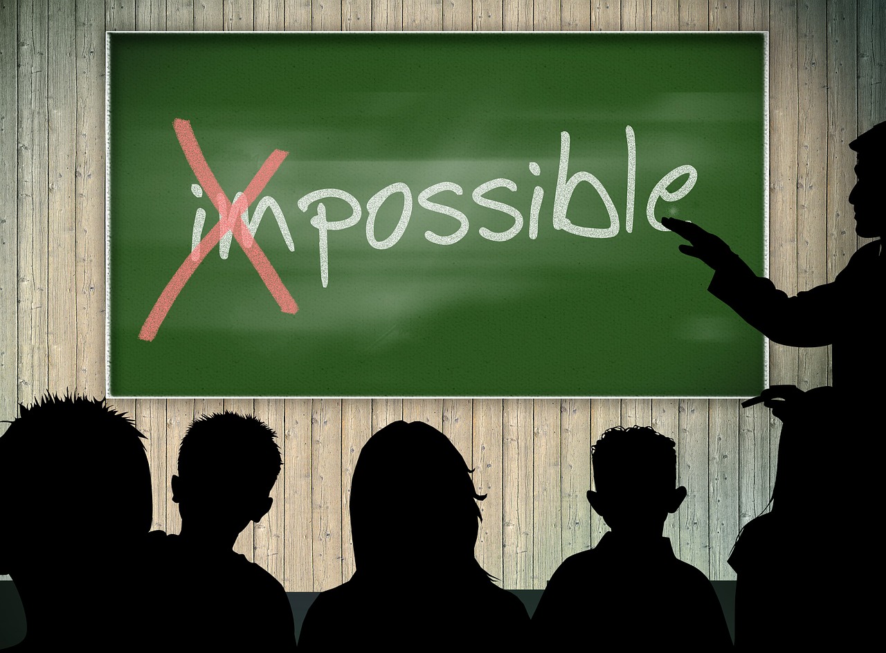 the word impossible on a chalkboard with the 'im' crossed out so it says possible